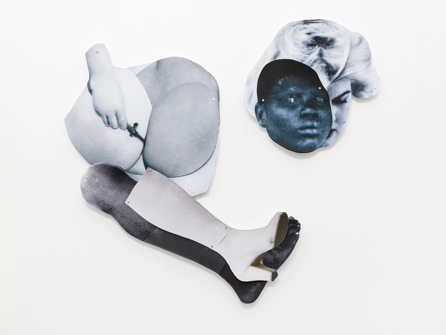 Frida Orupabo<br/>Entangle, 2023<br/>collage: pigment print on acidfree<br/>cotton paper, mounting tape,<br/>split pins<br/>two heads: 53 x 55 cm<br/>bum and legs: 102 x 98 cm<br/>(FO00270)